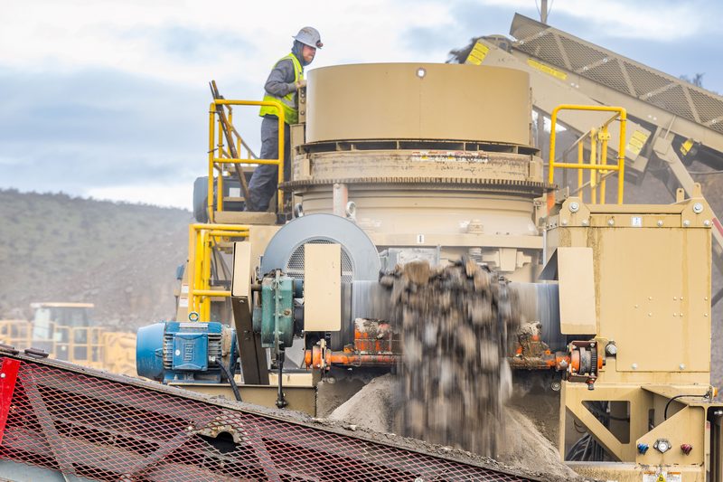 A cone crusher being serviced on site